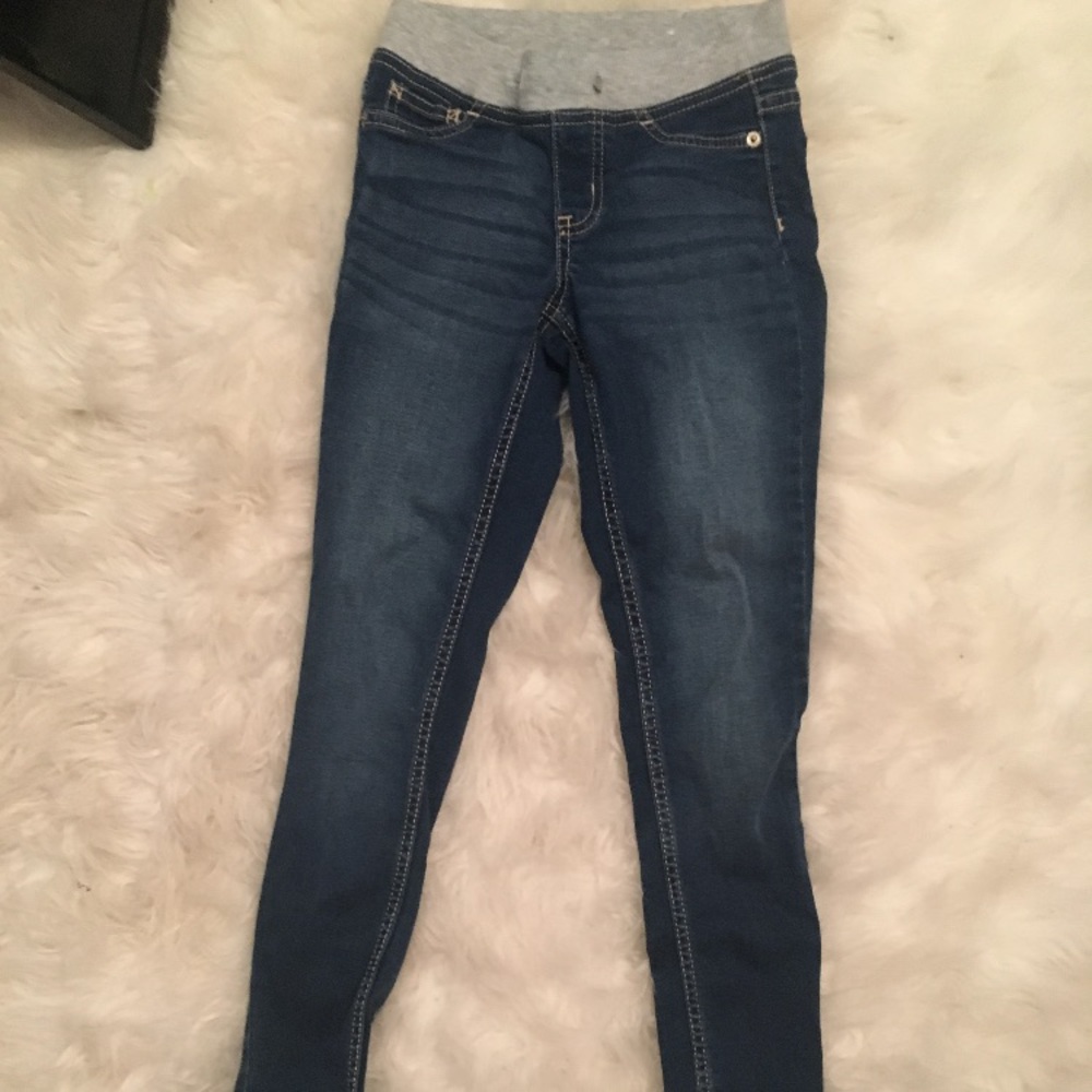 Dark blue jeans with gray on top